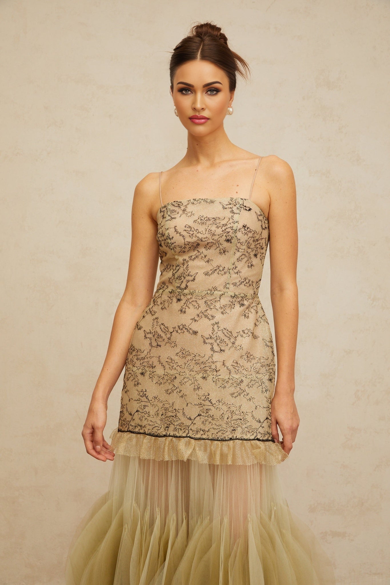 A green midi dress with embroidered details and panelled design named Mathilde