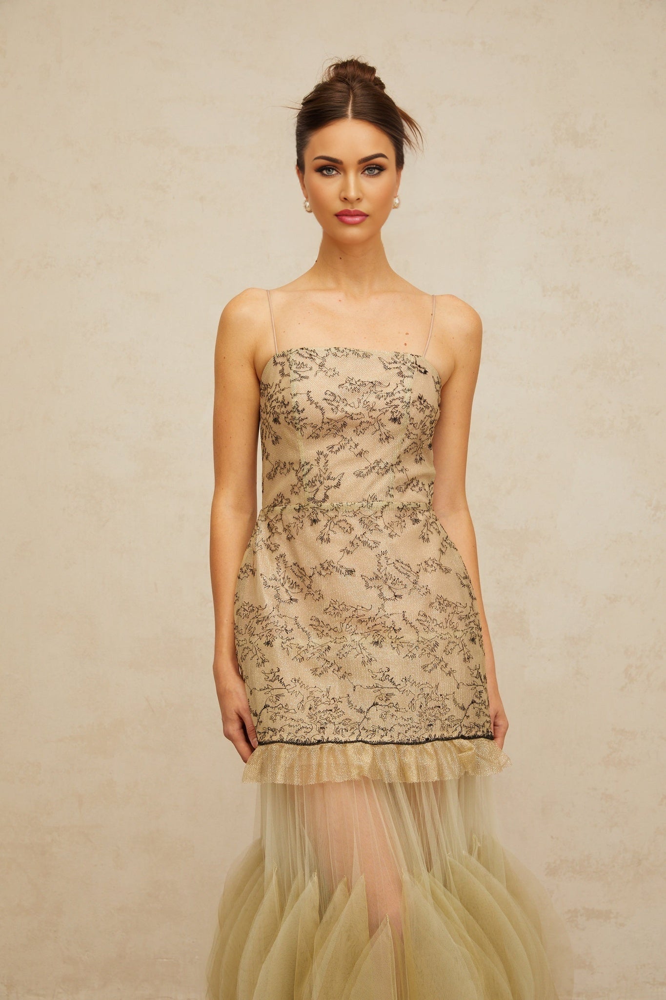 A green midi dress with embroidered details and panelled design named Mathilde
