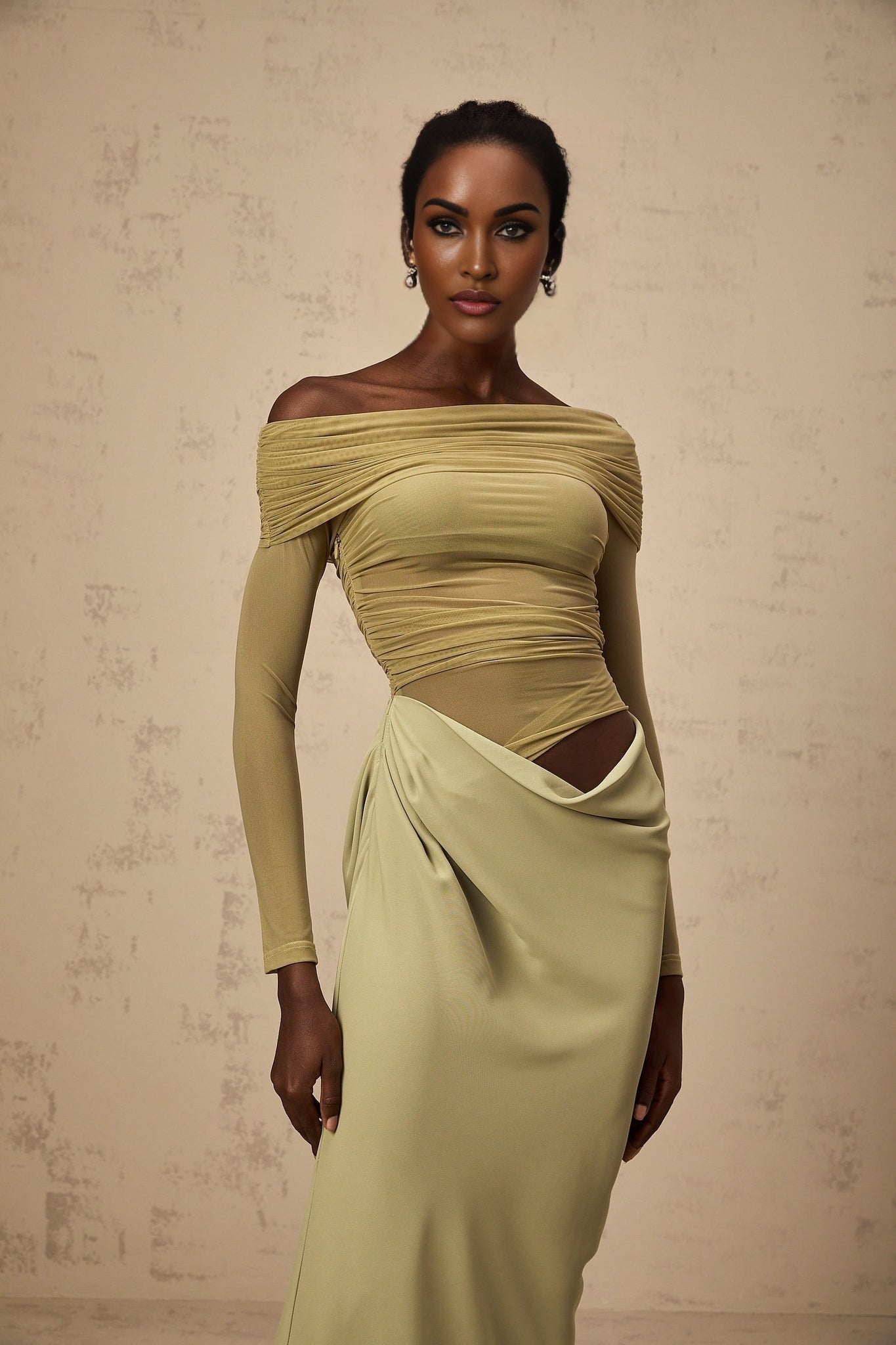A green offshoulder midi dress with a semisheer design named Estelle
