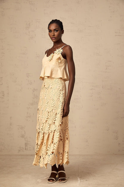 A khaki colored matching set featuring a cutout flared top and skirt by Celine