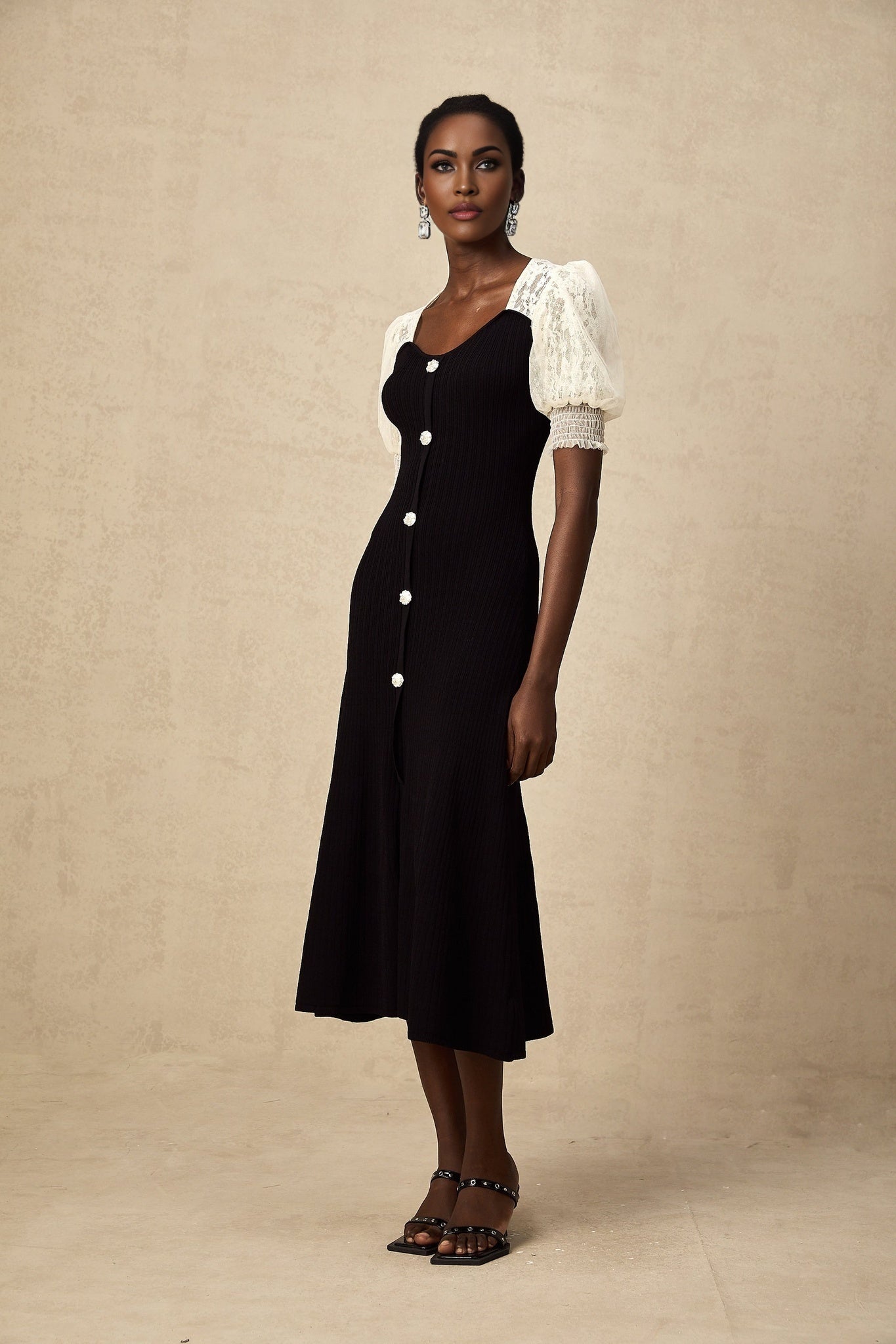 A knit midi dress with lace trim details named Noa