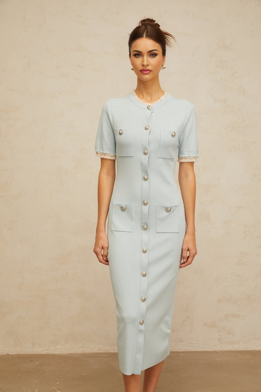 A light blue knit midi dress with a pencil silhouette featuring a fitted bodice and slim skirt that falls to mid calf length