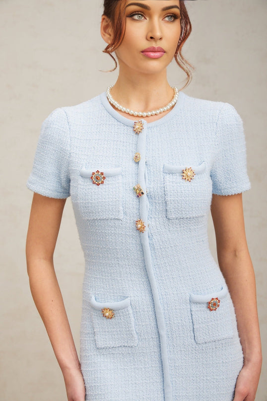 A light blue knitted mini dress with crystal embellishments covering the bodice and sleeves named Cindy