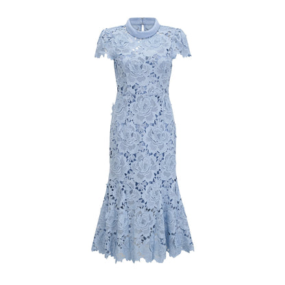 A light blue midi dress with delicate floral lace appliques covering the bodice and skirt creating an elegant and romantic silhouette
