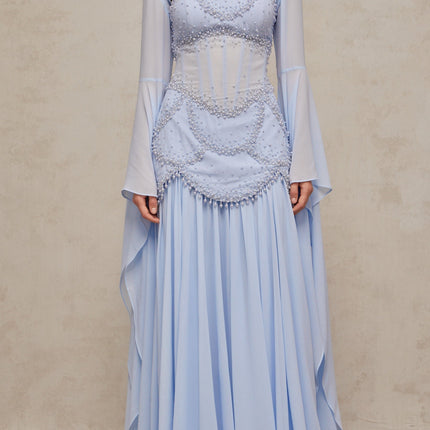 A light blue pleated maxi dress with faux pearl embellishments by Gaelle