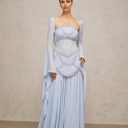 A light blue pleated maxi dress with faux pearl embellishments by Gaelle