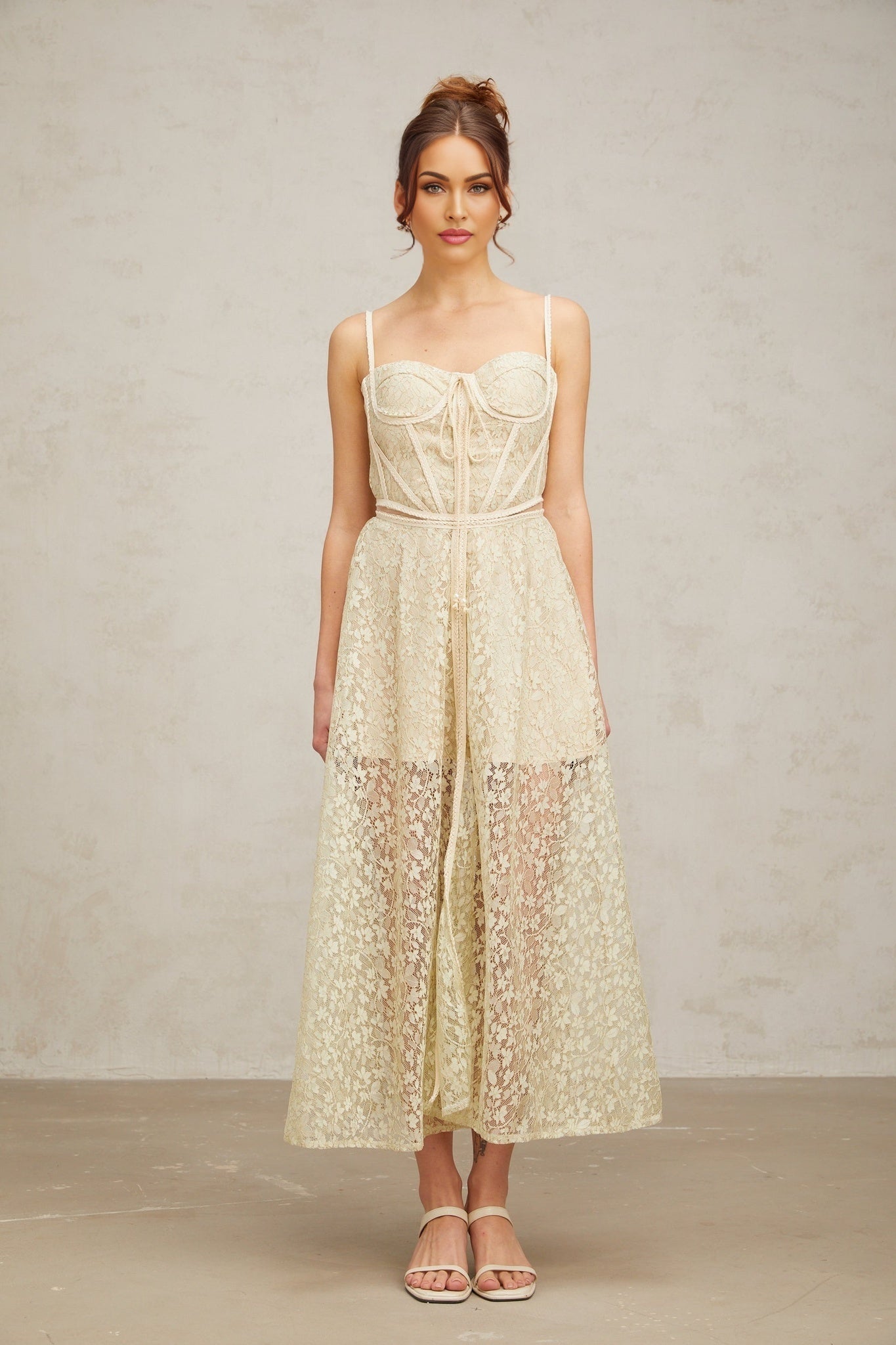 A light green midi dress with floral embroidery details named Yasmine