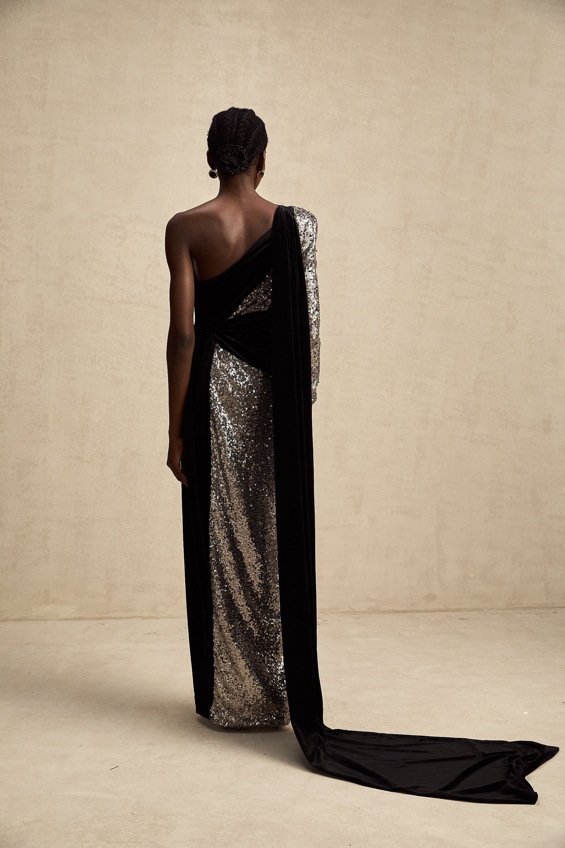 A long asymmetric maxi dress with sequin embellishments named Juliette featuring a flowing silhouette and sparkling details