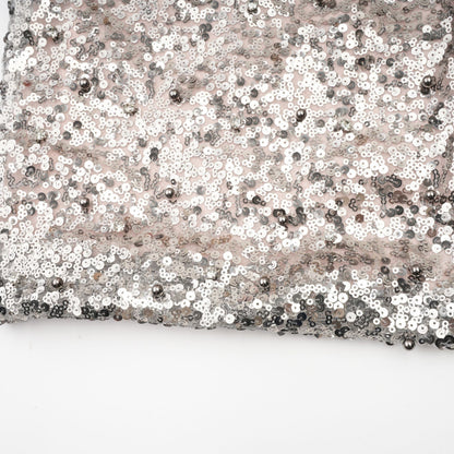 A long asymmetric maxi dress with sequin embellishments named Juliette featuring a flowing silhouette and sparkling details