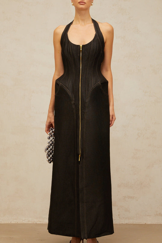 A long black denim maxi dress with a front slit and visible contrast stitching named Adrienne