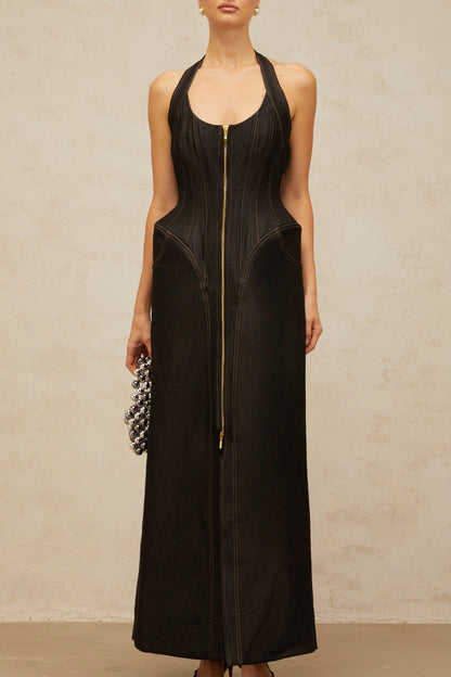 A long black denim maxi dress with a front slit and visible contrast stitching named Adrienne
