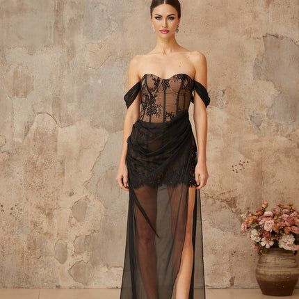 A long black dress with a fitted corset bodice made of floral lace and sheer tulle panels extending into a flowing maxi skirt