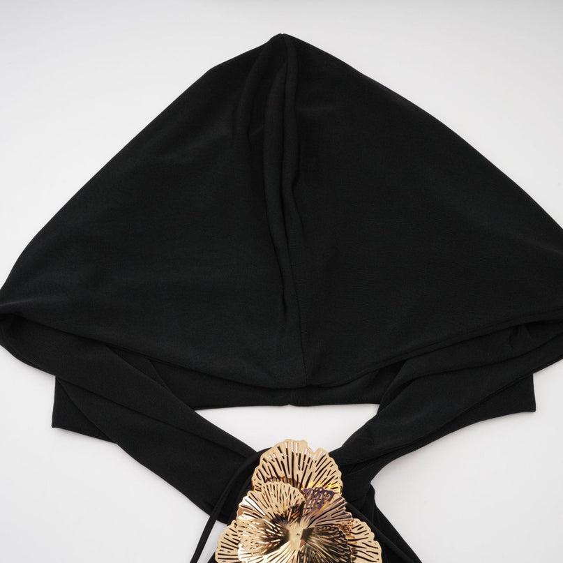 A long black hooded maxi dress with floral applique details named Axelle