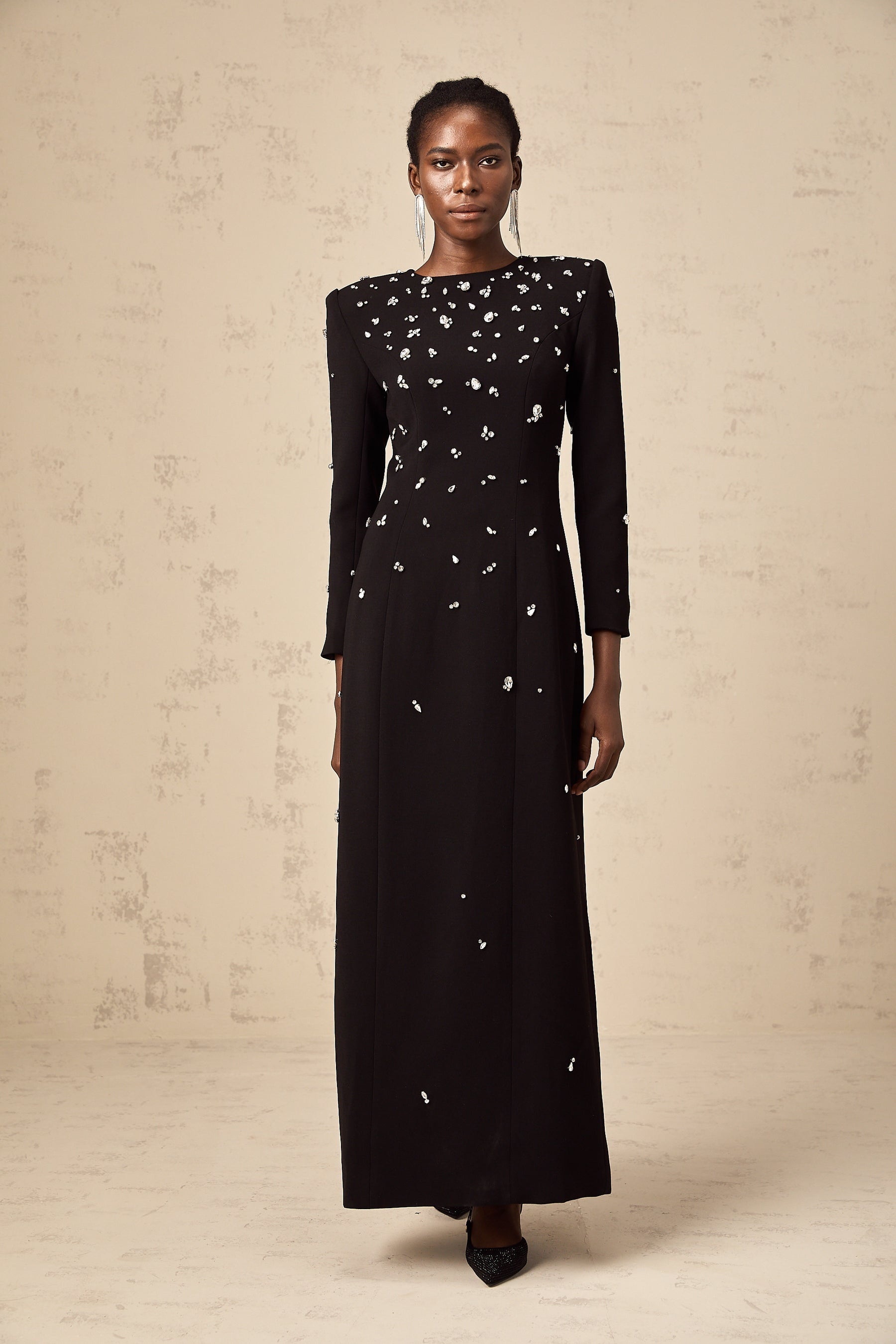 A long black maxi dress adorned with sparkling crystal embellishments elegant formal evening gown
