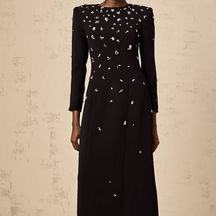 A long black maxi dress adorned with sparkling crystal embellishments elegant formal evening gown