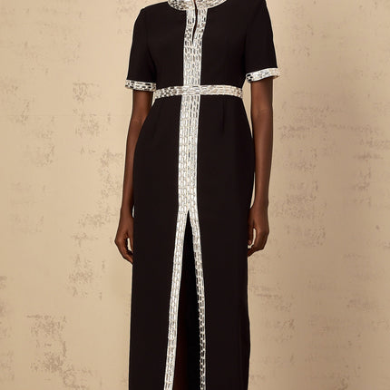 A long black maxi dress with a front slit and crystal embellishments worn by a model