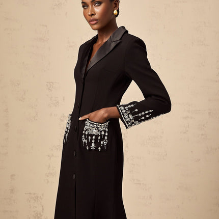A long black maxi dress with blazer style top featuring embellishments and a fitted silhouette suitable for formal occasions