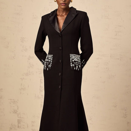 A long black maxi dress with blazer styling featuring embellished details and a feminine silhouette