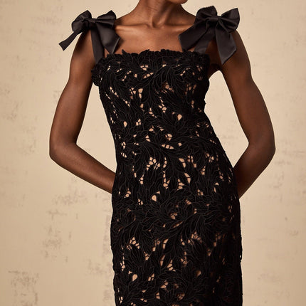 A long black maxi dress with floral embroidery detailing named Eloise