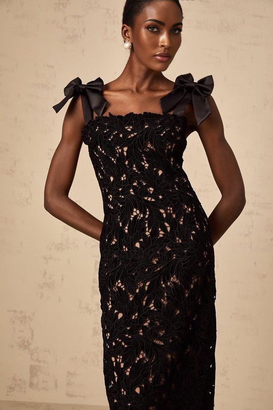 A long black maxi dress with floral embroidery detailing named Eloise