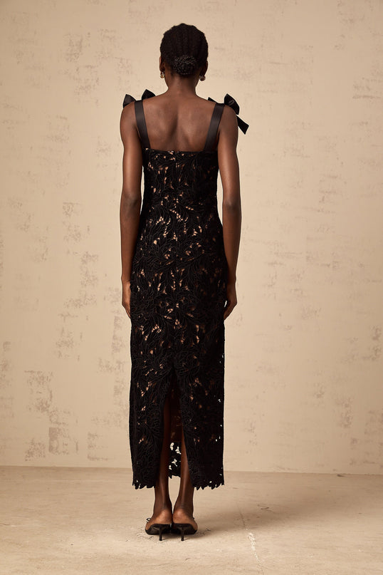 A long black maxi dress with floral embroidery details named Eloise