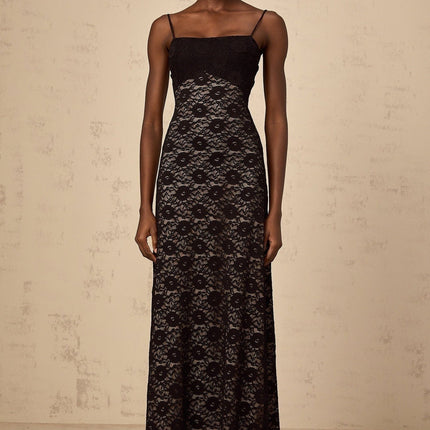 A long black maxi dress with floral lace pattern and open back design named Zelie