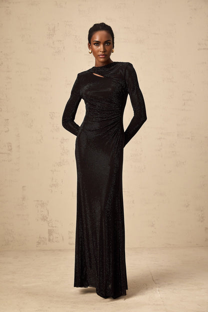 A long black maxi dress with ruched mesh fabric and rhinestone embellishments