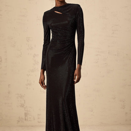 A long black maxi dress with ruched mesh fabric and rhinestone embellishments