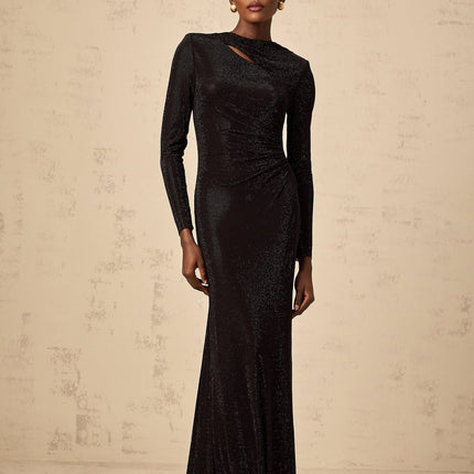 A long black maxi dress with ruched mesh fabric and rhinestone embellishments