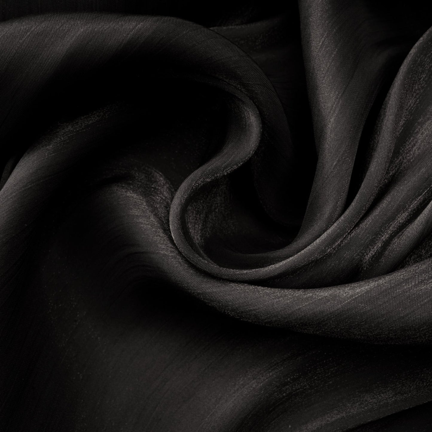 A long black pleated satin maxi dress with a flowing silhouette named Mila