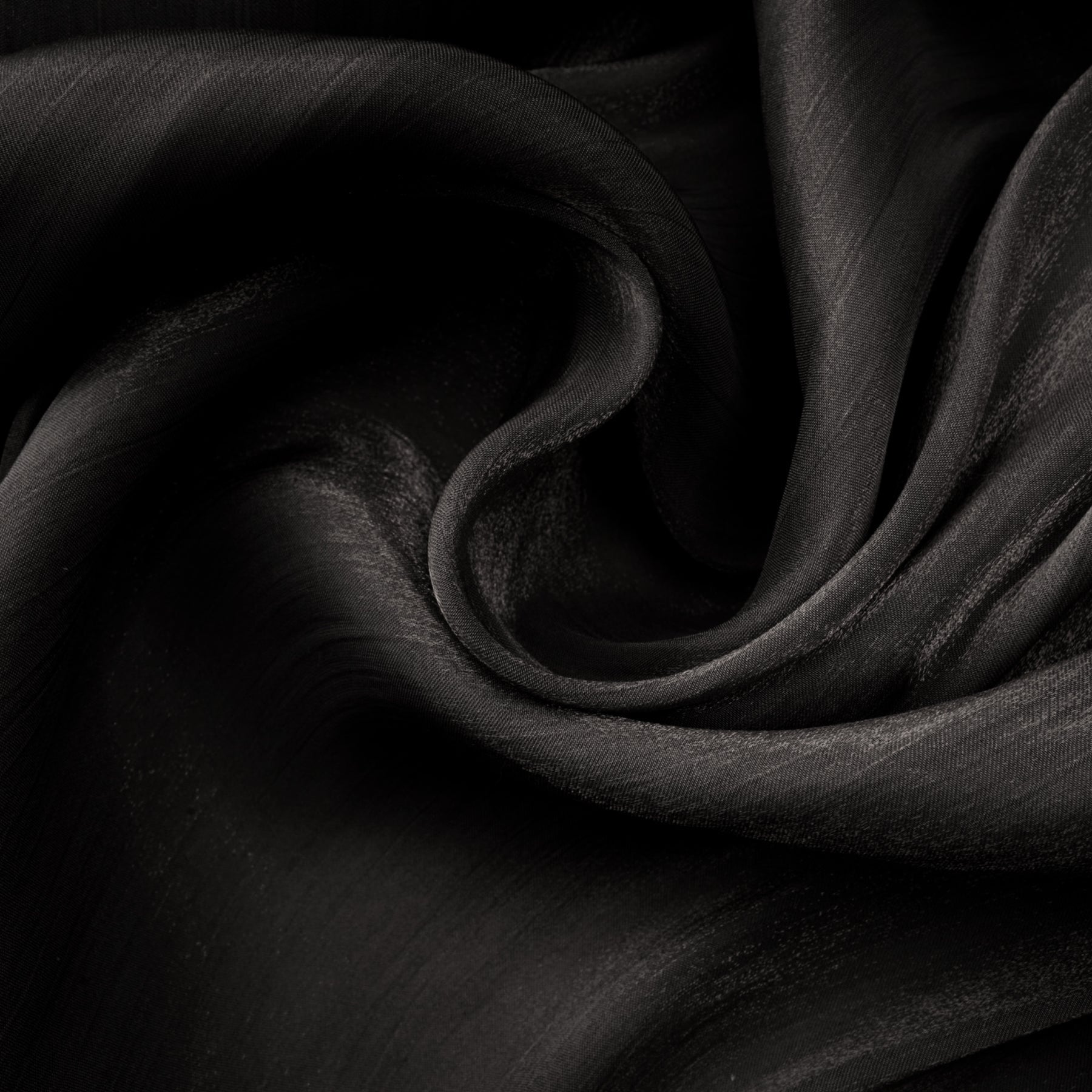 A long black pleated satin maxi dress with a flowing silhouette named Mila