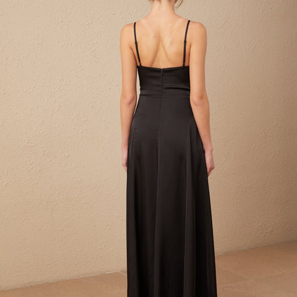 A long black satin maxi dress with a V neckline and front slit named Blanche