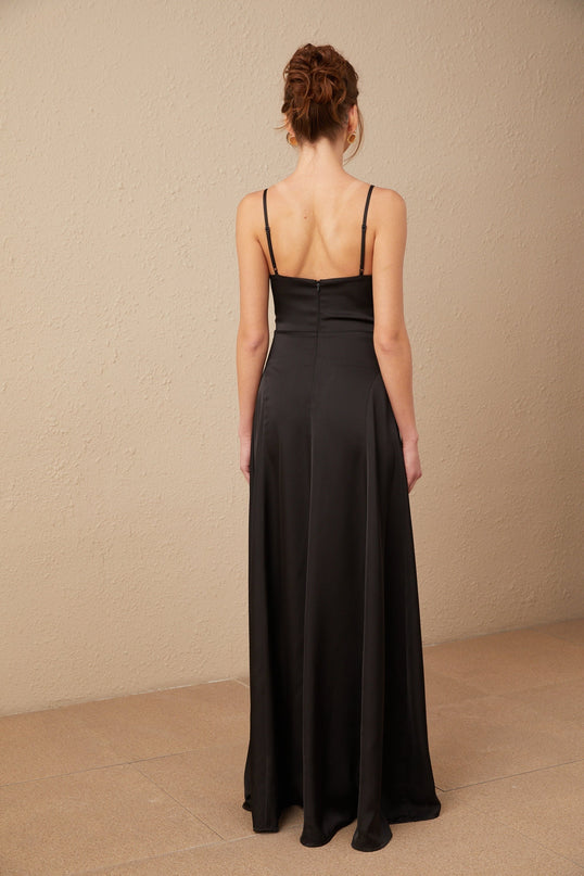 A long black satin maxi dress with a V neckline and front slit named Blanche