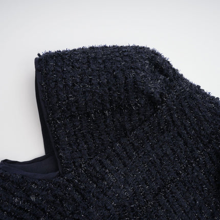 A long blue dress with a fitted bodice and flared peplum waist featuring panelled construction and a flowing maxi skirt