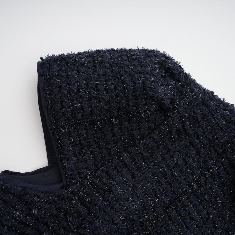 A long blue dress with a fitted bodice and flared peplum waist featuring panelled construction and a flowing maxi skirt