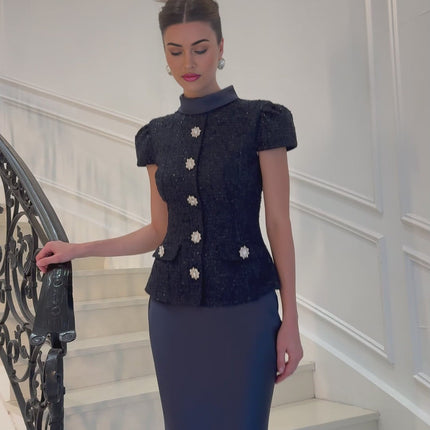 A long blue maxi dress with a peplum waist and paneled design features named Josette