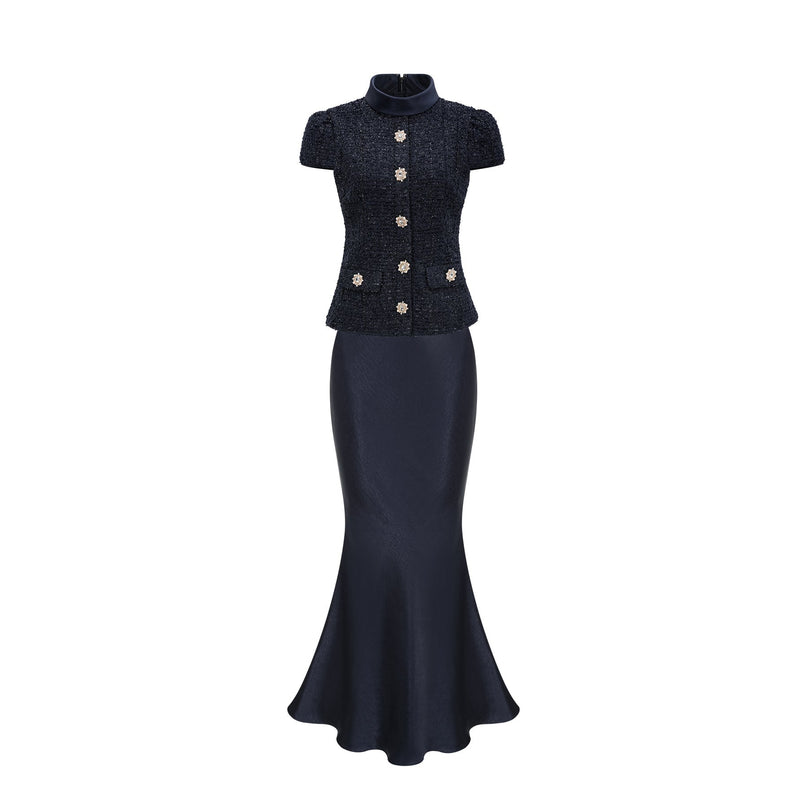 A long blue maxi dress with a peplum waist and paneled design featuring a Josette style