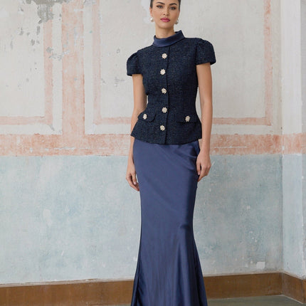 A long blue maxi dress with a peplum waist and paneled design featuring the Josette style