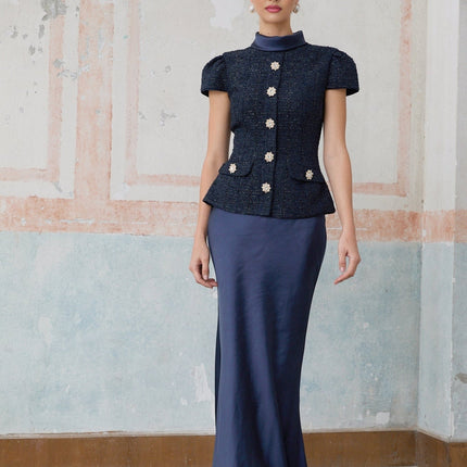 A long blue maxi dress with a peplum waist and panelled design featuring the Josette style