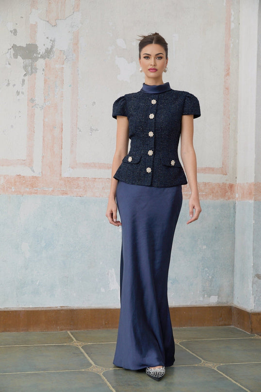 A long blue maxi dress with a peplum waist and panelled design featuring the Josette style