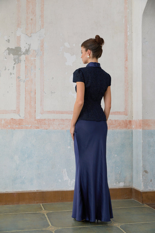 A long blue maxi dress with a peplum waist and panelled design featuring the Josette style