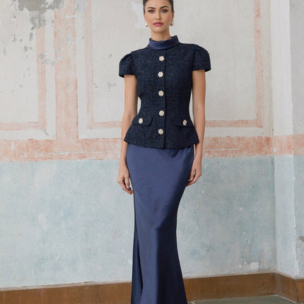 A long blue maxi dress with a peplum waist and panelled design featuring the Josette style