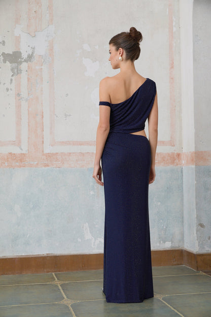 A long blue maxi dress with cut out details and rhinestone embellishments
