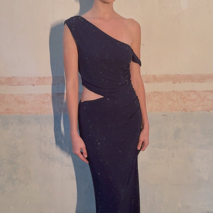 A long blue maxi dress with cutout details and rhinestone embellishments