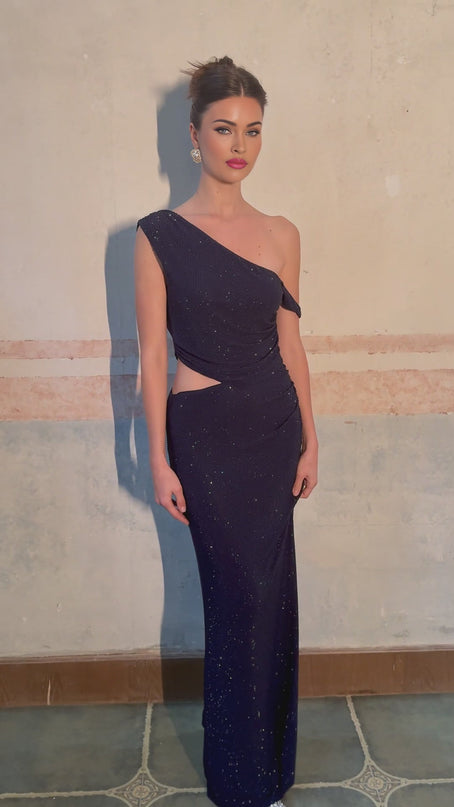 A long blue maxi dress with cutout details and rhinestone embellishments