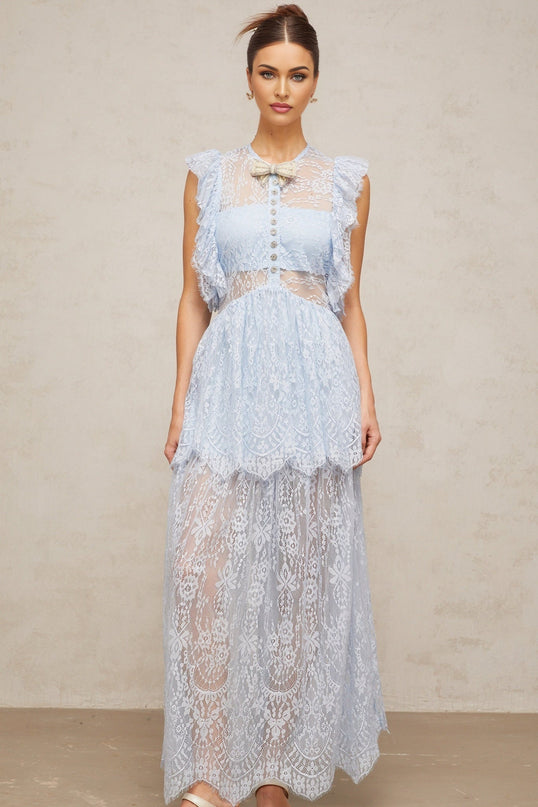 A long blue maxi dress with layered lace details and a feminine silhouette named Capucine
