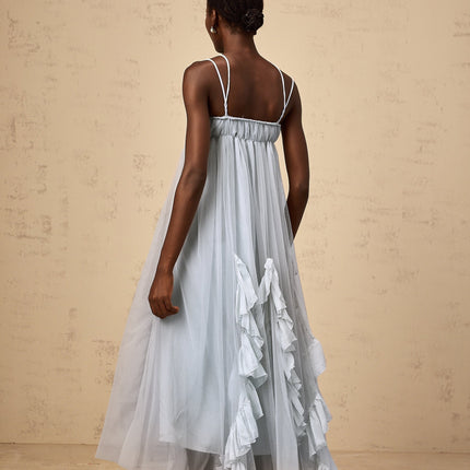 A long blue maxi dress with layered ruffled tulle skirt and sleeveless bodice