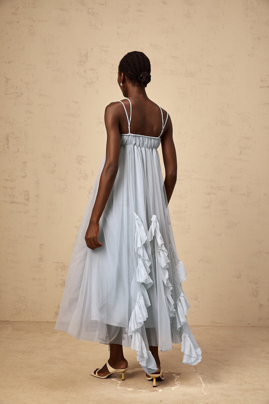 A long blue maxi dress with layered ruffled tulle skirt and sleeveless bodice