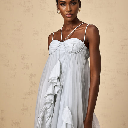 A long blue maxi dress with layered ruffles and a tulle skirt called the Colette dress