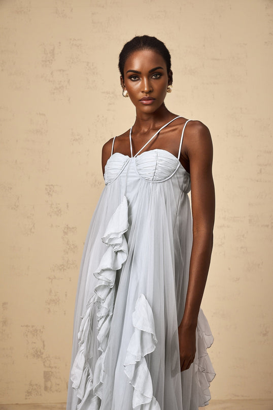 A long blue maxi dress with layered ruffles and a tulle skirt called the Colette dress